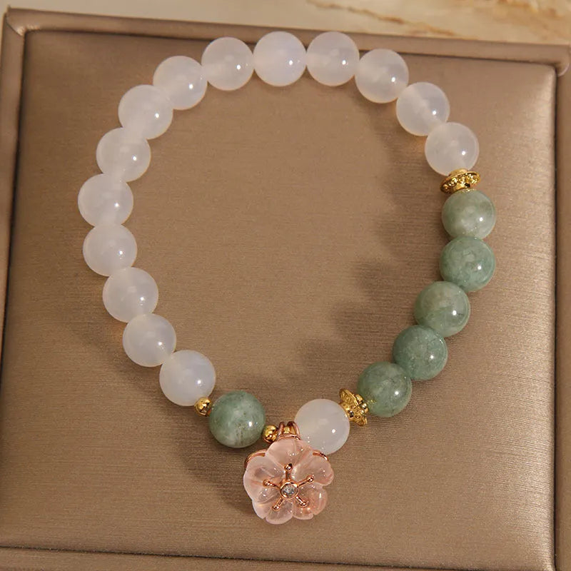 White agate jade bracelet with pink floral detailing and adjustable fastening