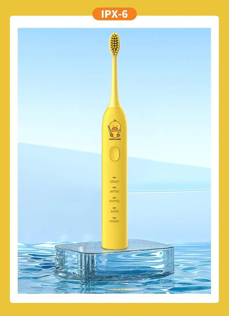 Yellow duck designed rechargeable electric toothbrush with USB port and soft bristle head.