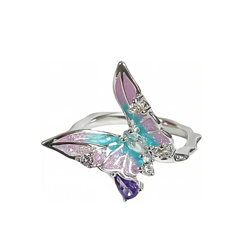 Adjustable copper insect ring showing detailed modelling and dripping oil colour treatment on finger