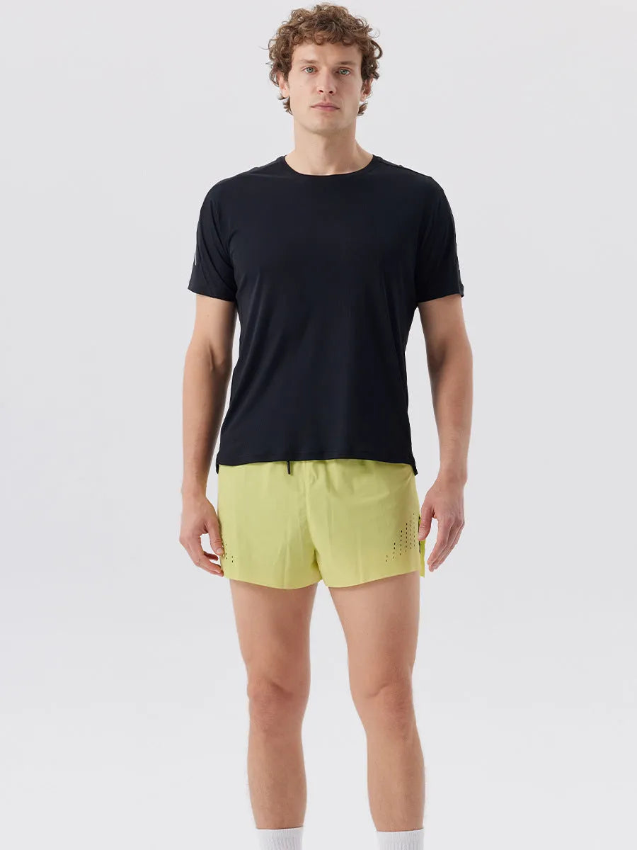 Men's straight-cut nylon sports shorts with side slits, shown in turmeric yellow, for summer athletic wear.