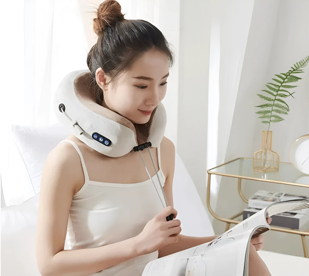 Brown U-shaped electric neck massage pillow on a grey background