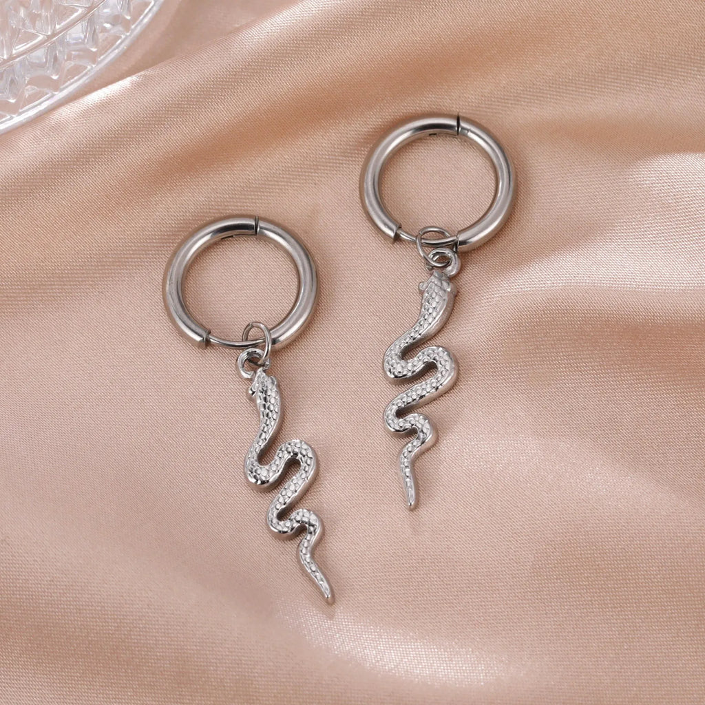 Gold plated stainless steel snake-shaped vintage earrings with detailed scale patterning and clip back closure