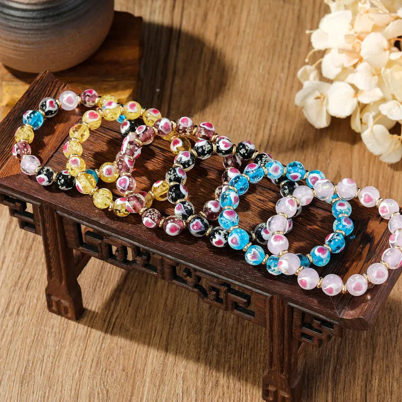 Handmade ancient fluorescent glaze bracelet with swallowing gold beast design on 10mm heart-shaped beads