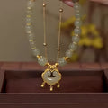 Green women's safety lock bell pendant bracelet with electroplated finish and drop-shaped charm