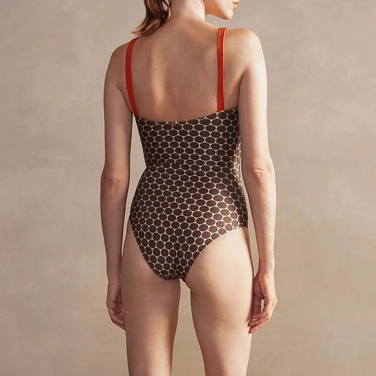Women's printed dots pattern one-piece swimsuit with matching wrap skirt, shown in multiple colours.
