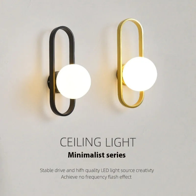 Minimalist wall lamp in black or gold with glass shade and iron body, showing 12W LED tri-colour lighting