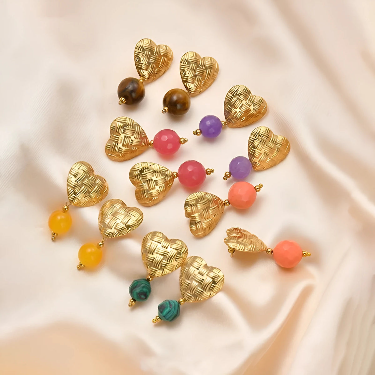 Woven big love heart ear studs with electroplated 14K gold finish, hanging beads, and titanium steel base in six colours.