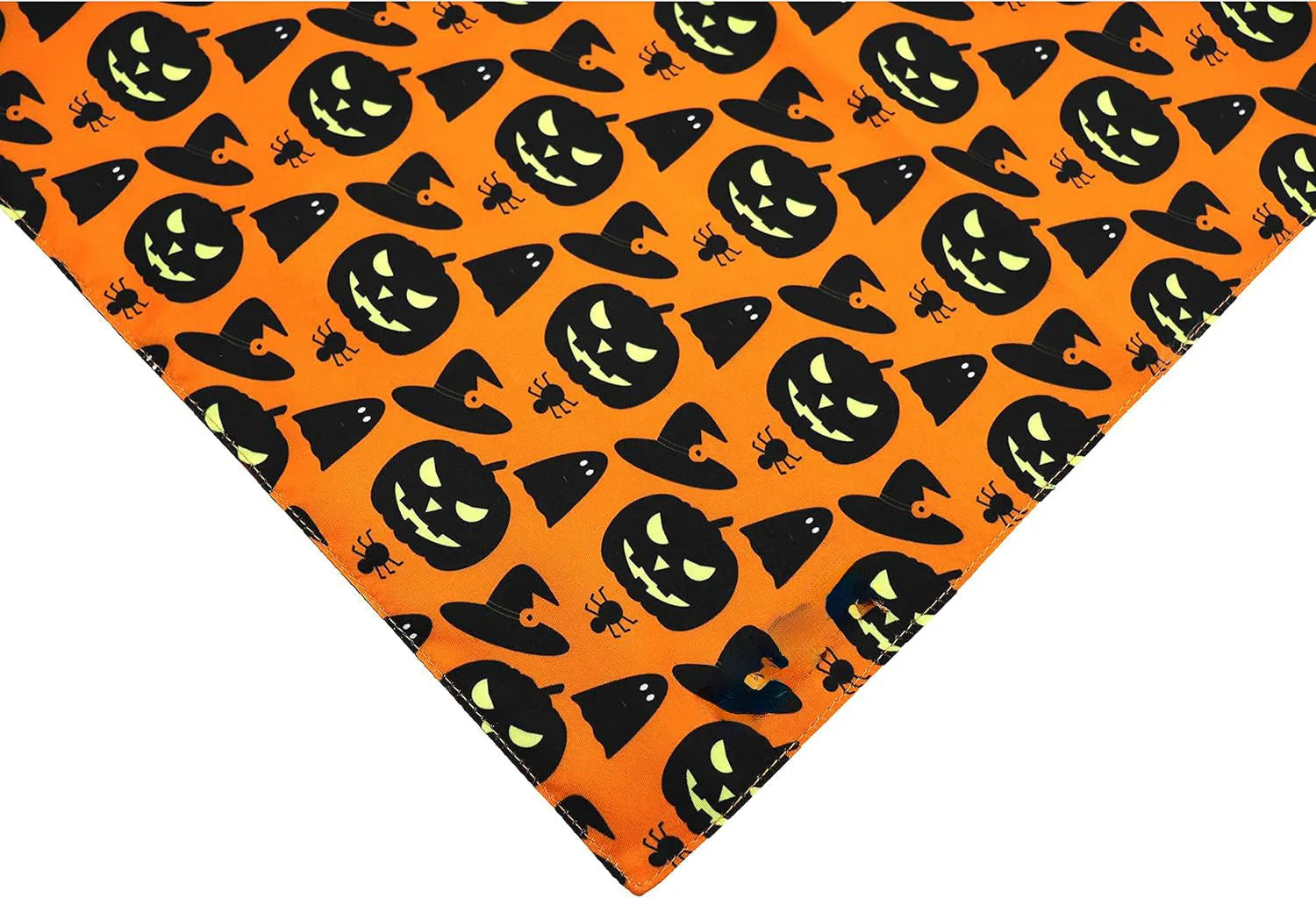 Black and orange reversible Halloween dog bandana with pumpkin and spider web patterns, shown on a dog's neck.