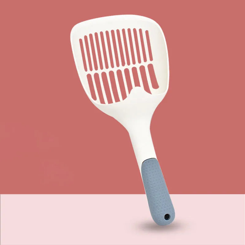 Large white plastic cat litter shovel with a slotted scoop head and handle.