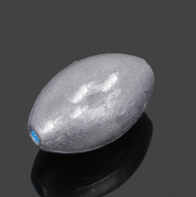 Rugby-shaped fishing sinker with scale texture, electrolytic lead construction, plastic core, 4cm length