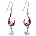 Close-up of zinc alloy Halloween earrings featuring a combined skull and wine glass design with an electroplated metallic finish.
