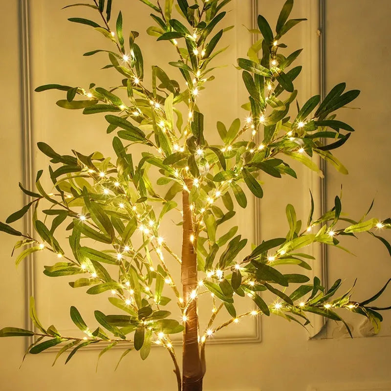 1.8m tall artificial olive tree lamp with warm white LED lights illuminating olive leaf foliage