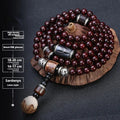 Men's Pterocarpus Santalinus rosewood bracelet with 108 beads in 6mm or 8mm size, showing traditional style details