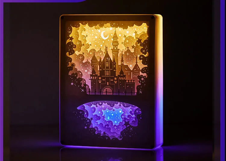 Modern white USB bedside night light with a carved plastic shade, sitting on a wooden table next to its remote control.