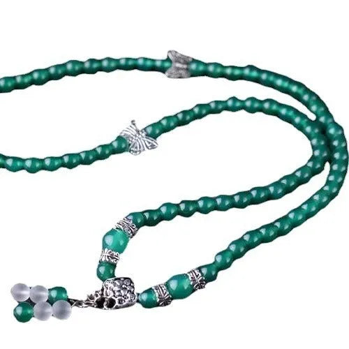 Close-up of a green agate multi-layer bracelet with three strands of 6mm round beads.