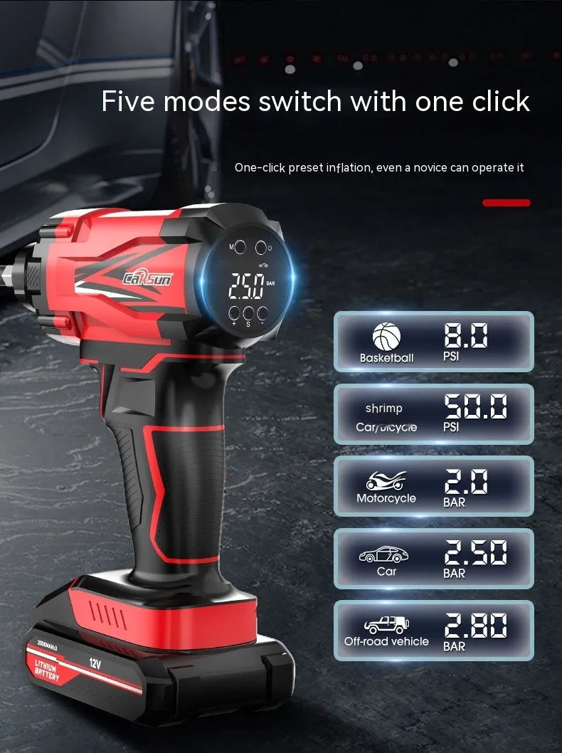 Red and black portable car tyre air pump with display, nozzles, and power cables on a table.