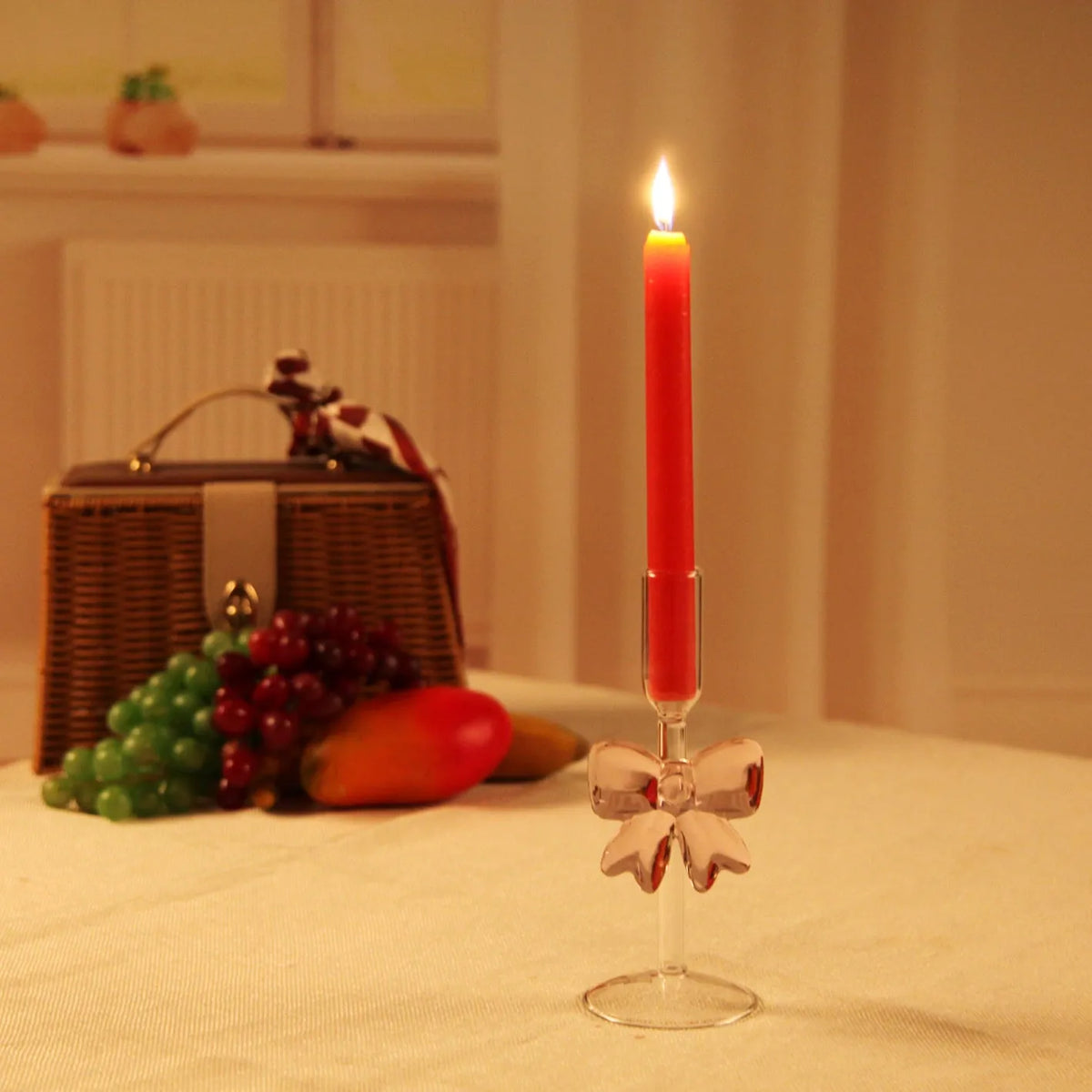 Handmade borosilicate glass bow candlestick holder with 2cm inner diameter and 7cm base, available in three heights