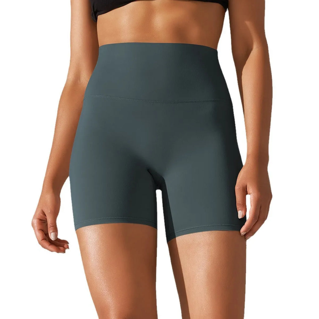 Women's high waist hip lift fitness tights in dark green, shown for sports and casual wear.