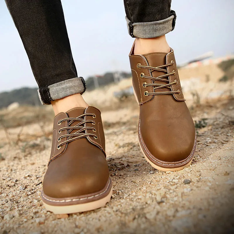 Men's mid-top waterproof boots with PU upper and rubber sole in black colour, sizes 39-44 available