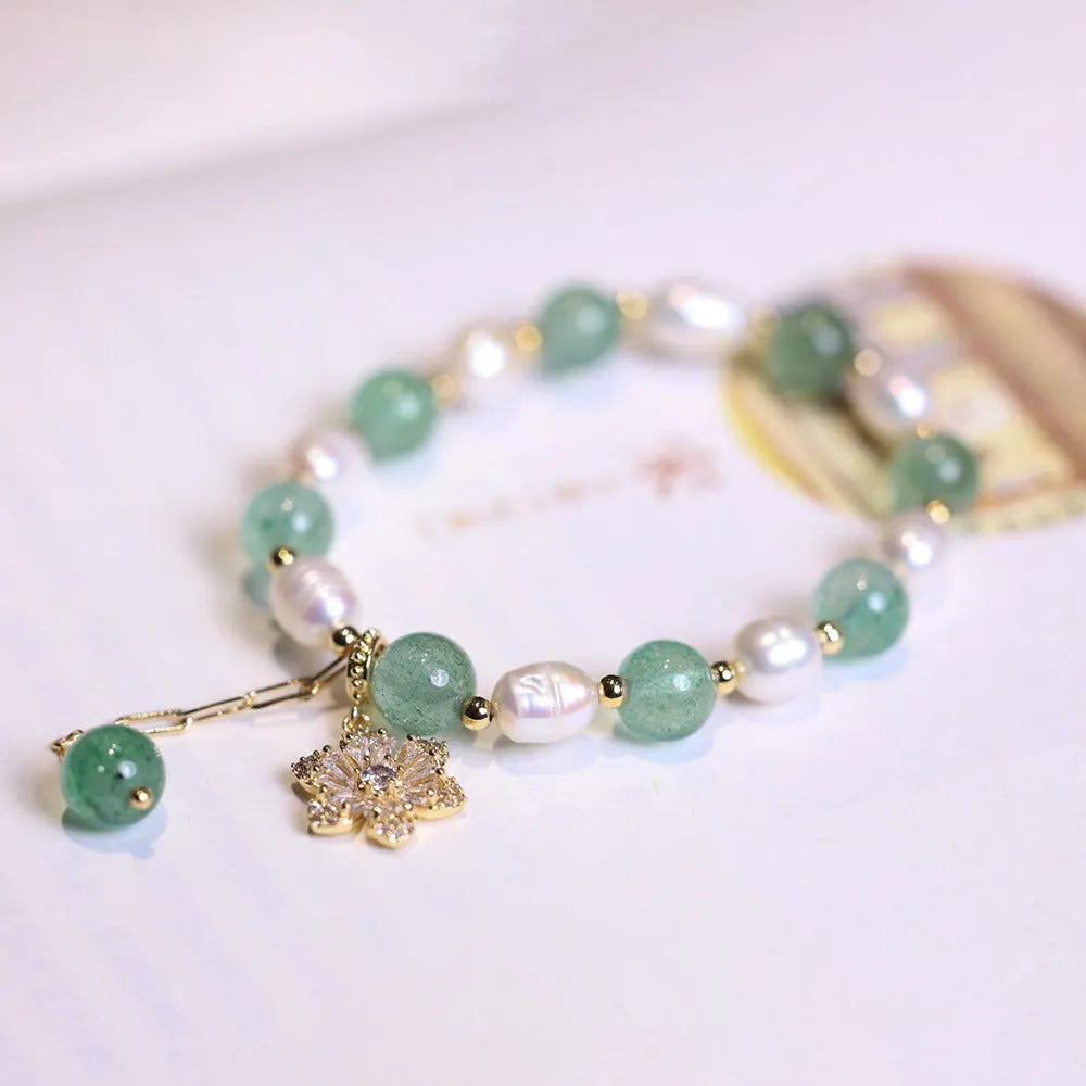 Green strawberry-shaped freshwater pearl bracelet with Chinese knot closure and small flower pendant
