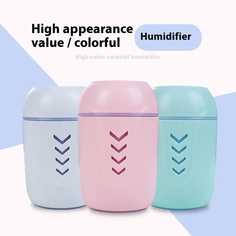 Round portable air purifier in blue, pink, or white with USB cable for vehicle or desktop use