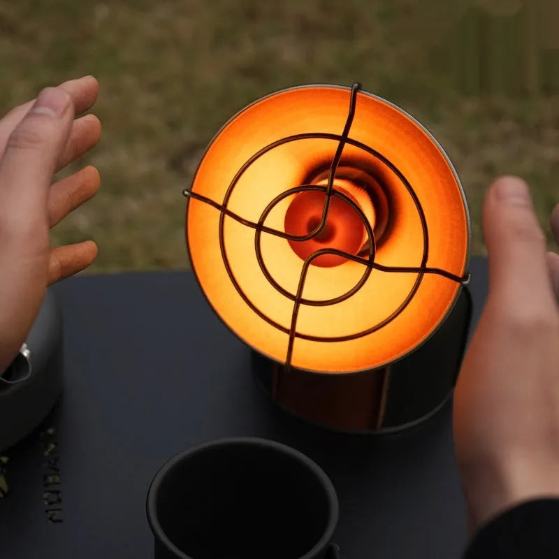 Black and orange portable heating stove with automatic ignition for outdoor camping