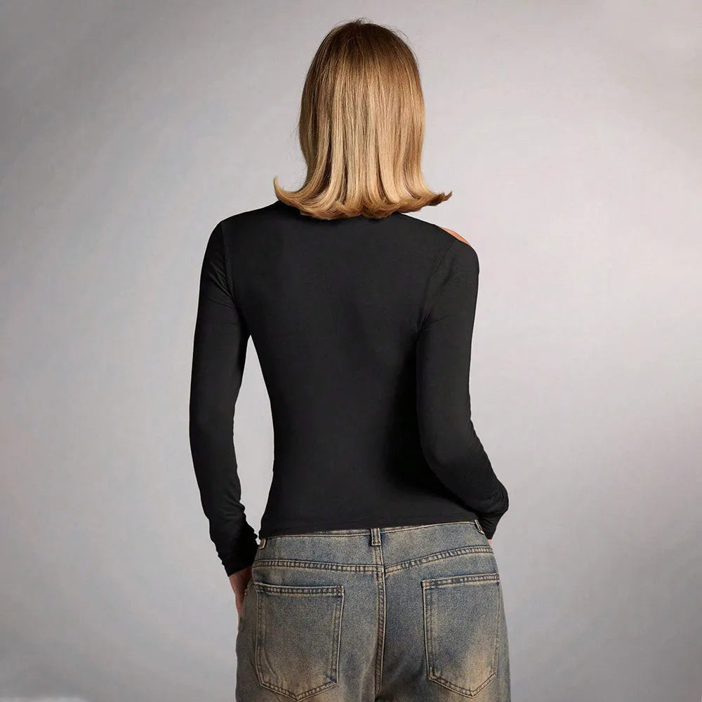 Black women's halterneck slim-fit top with long sleeves on a model.