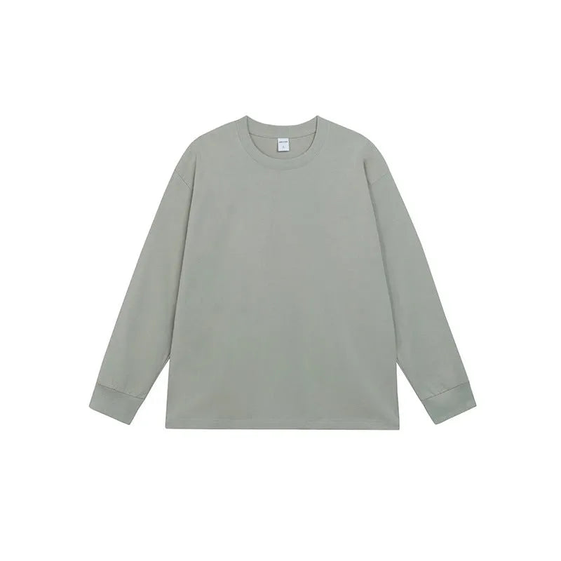 Men's simple solid colour long sleeve cotton t-shirt shown in loose fit on a hanger.