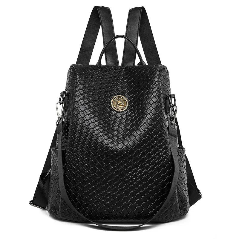 Women's black waterproof anti-theft backpack showing woven detailing and organisational compartments