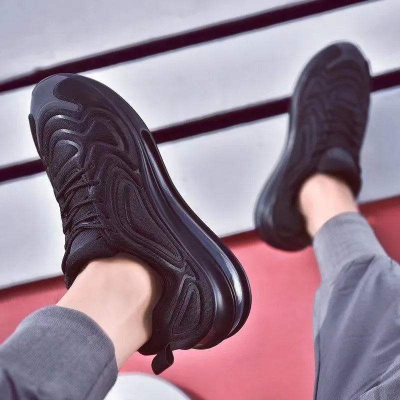 Men's black casual sneakers with a thick sole and lace-up front on a white background.