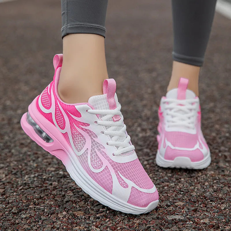Women's pink mesh casual sneaker with lace-up front and light-coloured PU sole.