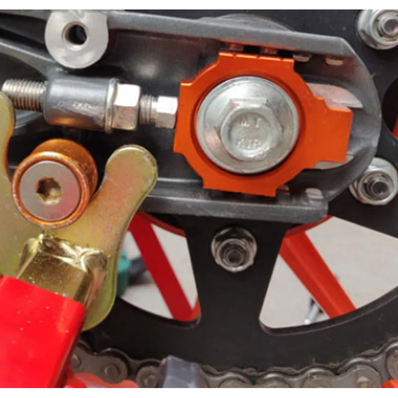 Pair of orange metal screw regulators for KTM DUKE motorcycle rear fork modification