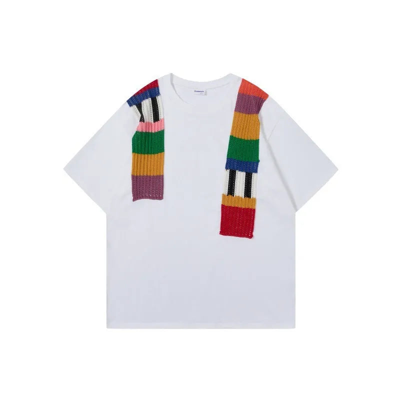 Cotton pullover with patchwork design showing letter patterns in loose fitting short sleeve style