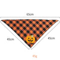Orange Halloween dog bandana with pumpkin and skeleton felt appliques on plaid fabric
