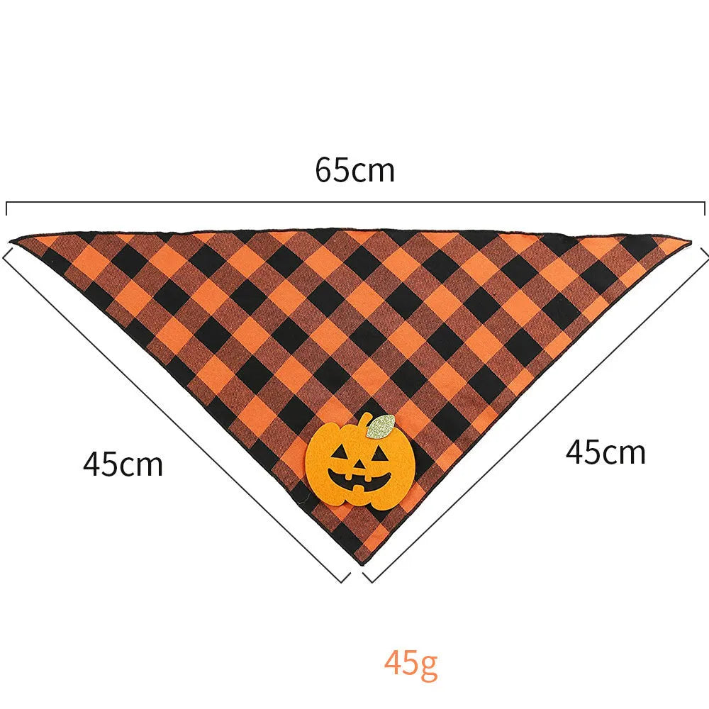 Orange Halloween dog bandana with pumpkin and skeleton felt appliques on plaid fabric