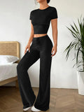Black high waist trousers and short sleeve t-shirt suit set on a hanger