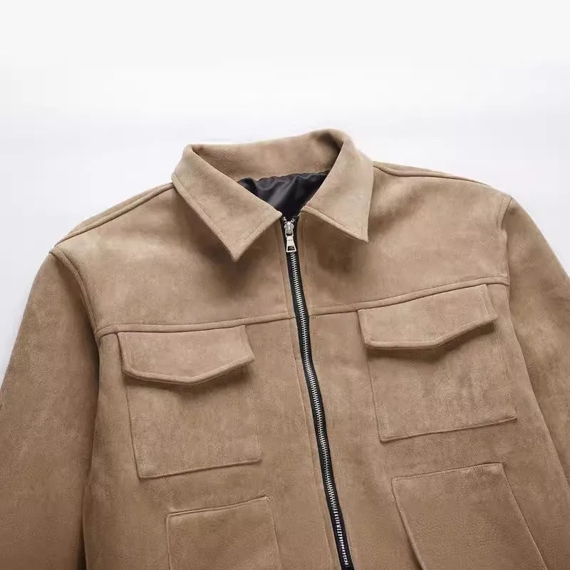 Man wearing a camel-coloured thickened zip-up jacket with large pockets and a slim fit.