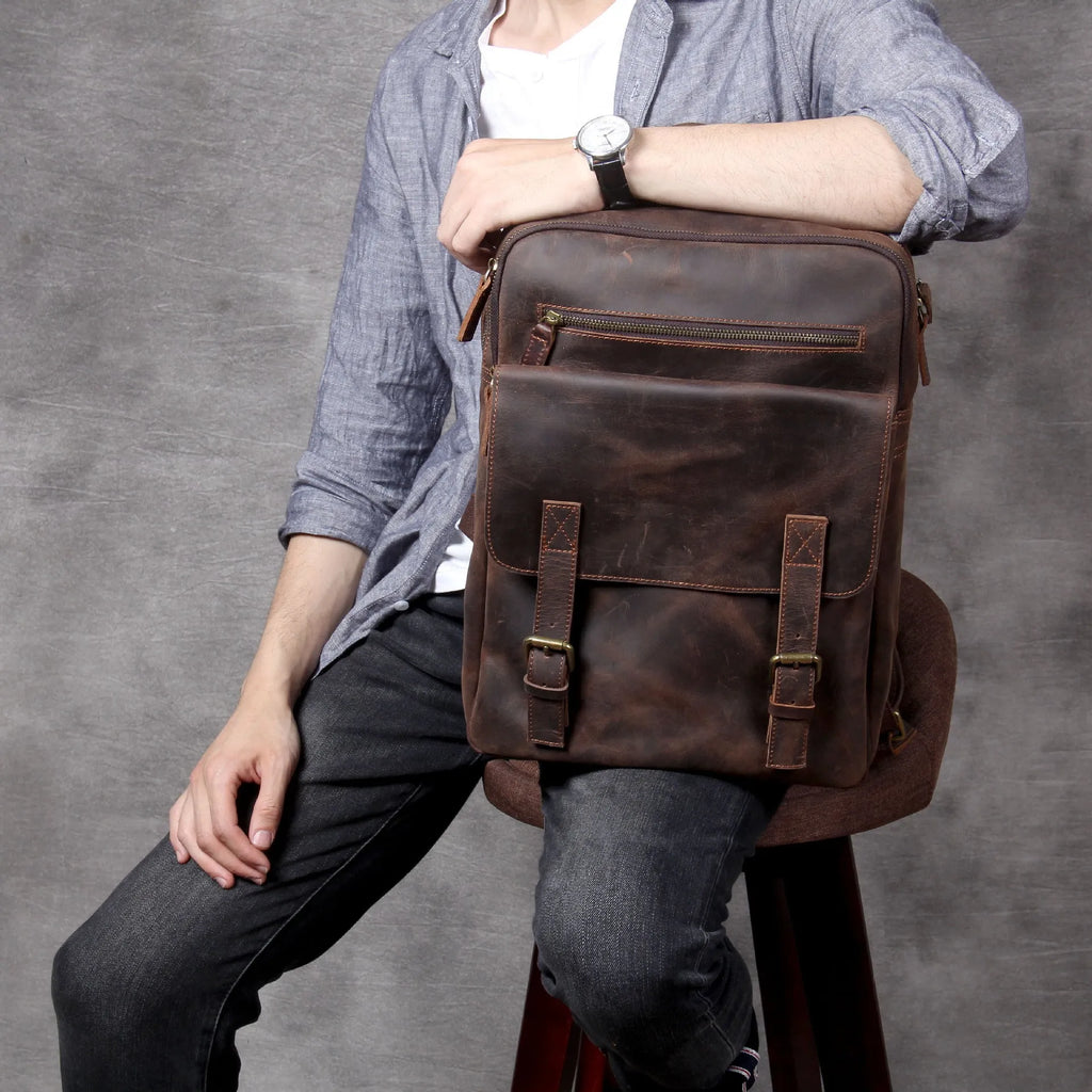 Dark coffee coloured handmade leather backpack with internal computer and mobile phone pockets.