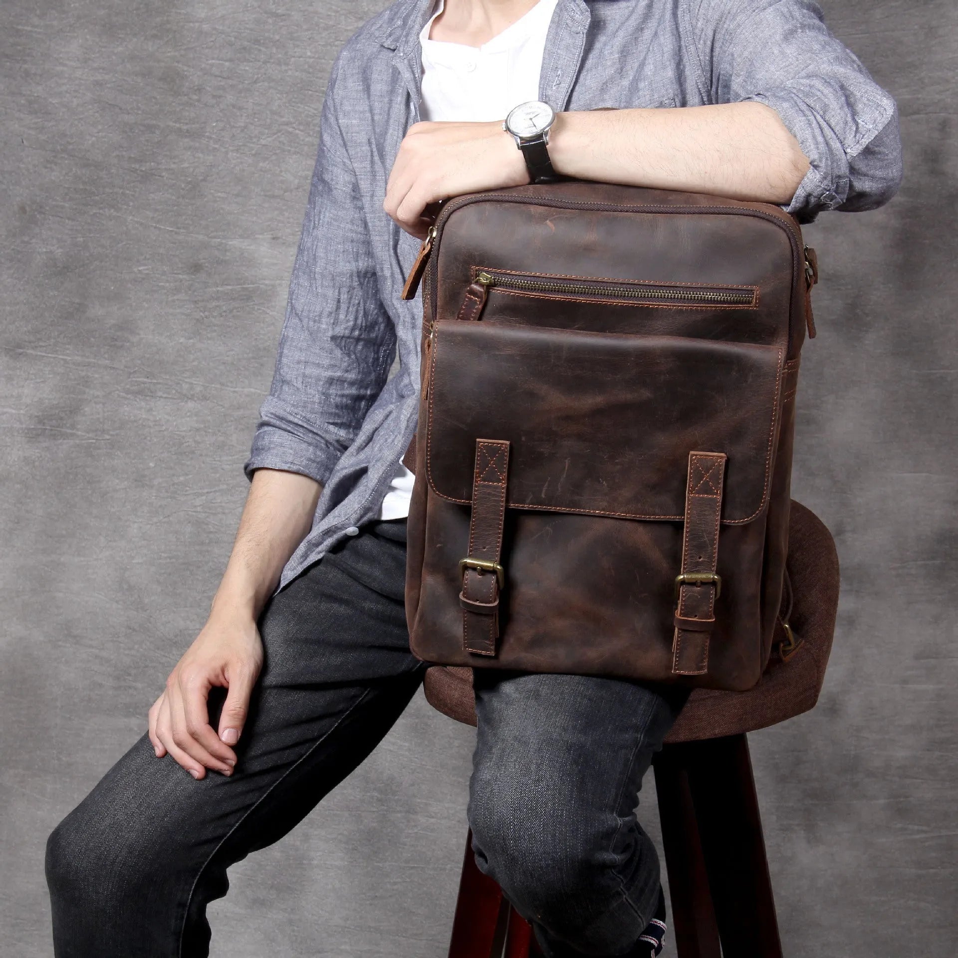 Dark coffee coloured handmade leather backpack with internal computer and mobile phone pockets.