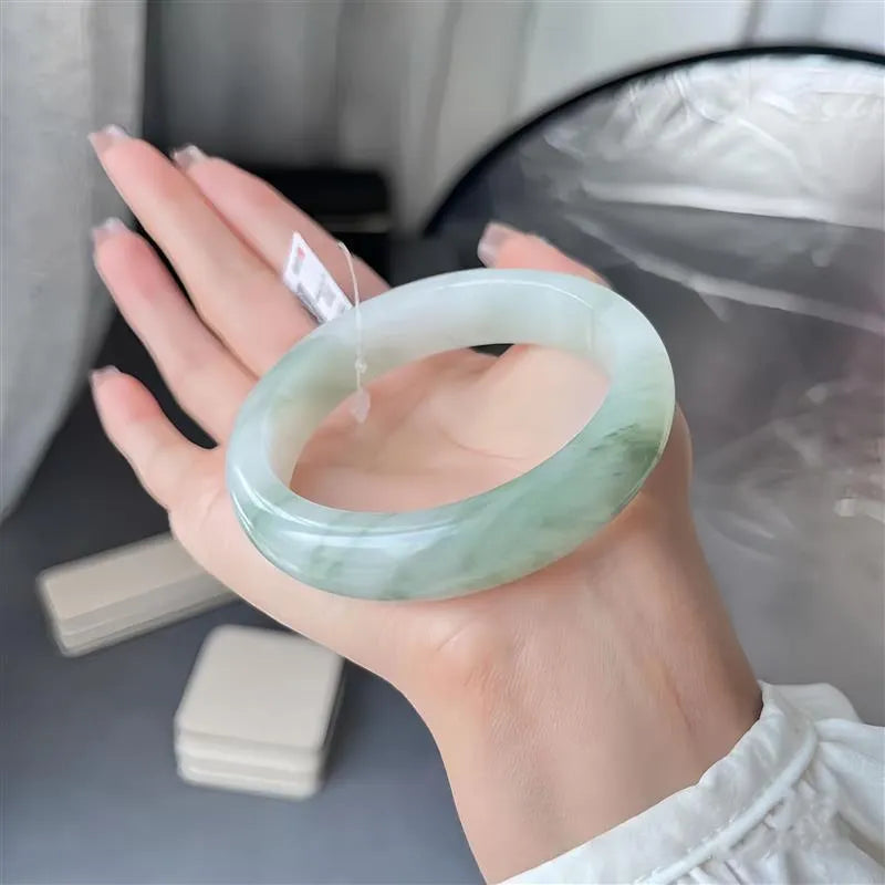 Children's Tian Shan Cui jadeite bracelet with animal zodiac motifs and floating flower inclusions
