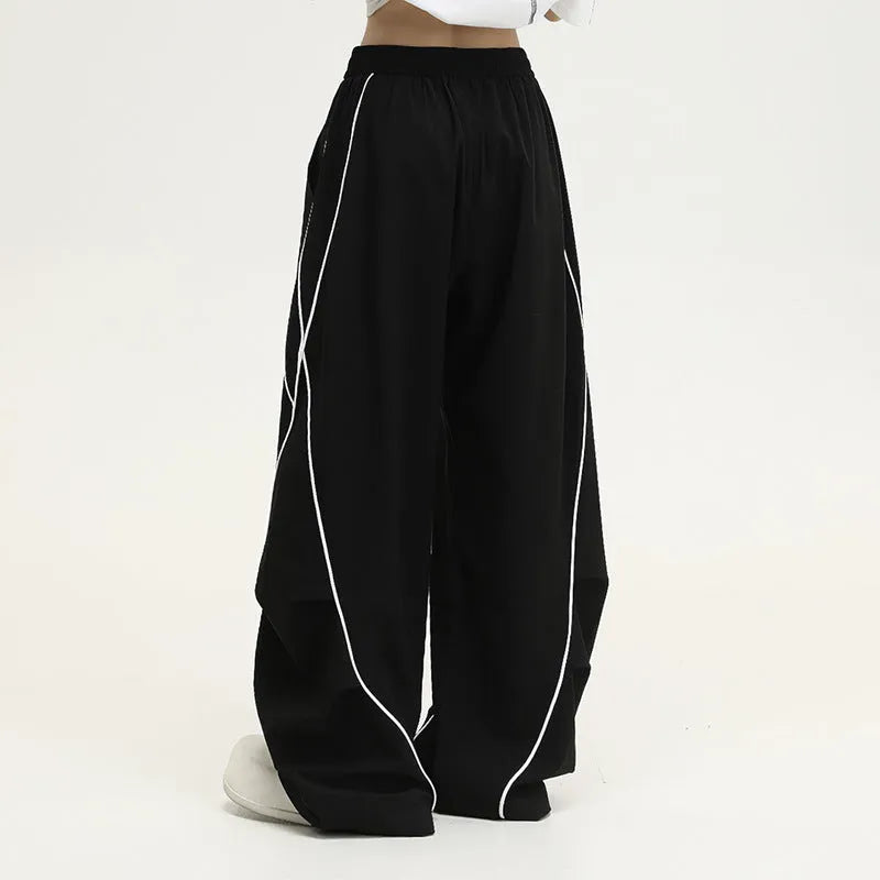 Black pleated wide-leg sports trousers with striped pattern and mid-waist design