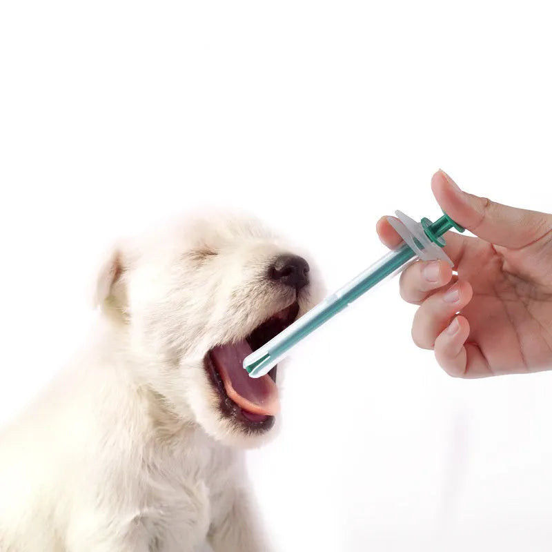 Two silicone pet pill shooters showing 15cm length and soft-tip design for medication administration