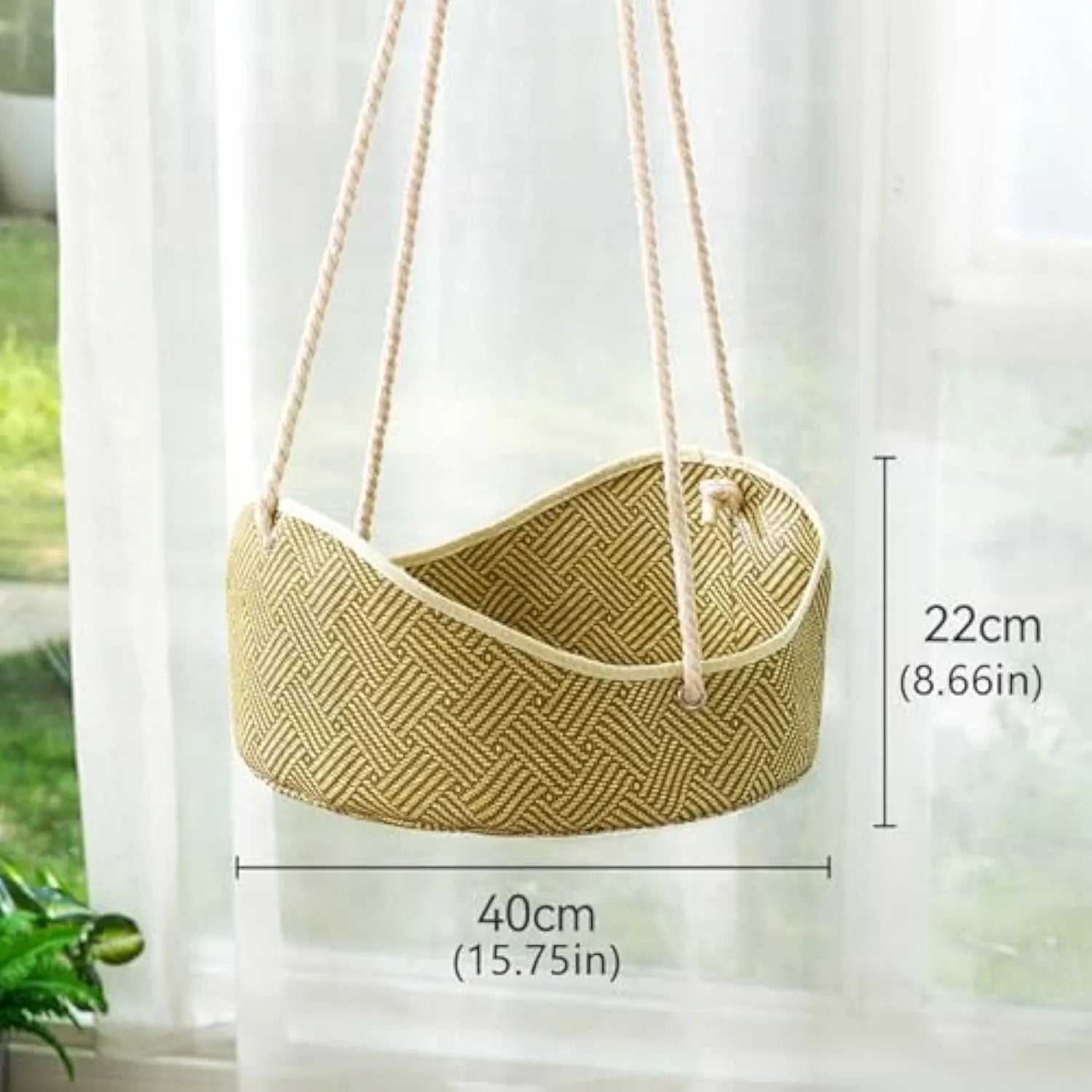 Green rattan cat hammock with metal hooks, shown hanging in a cage.