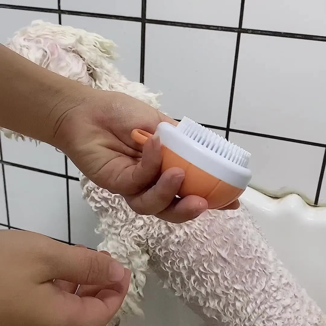 Orange TPR dog bath brush with shampoo dispenser and comb teeth for pet grooming