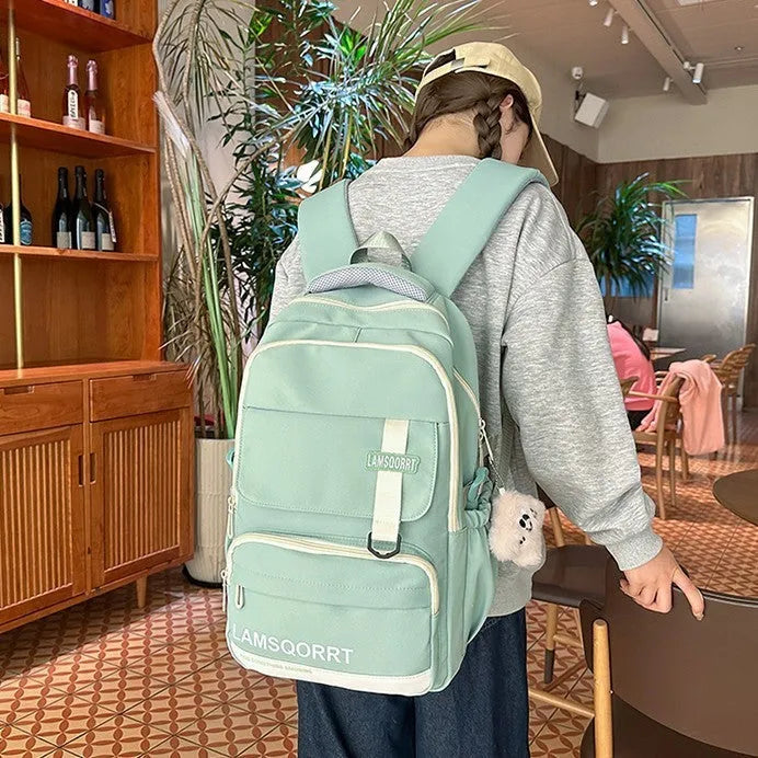 Waterproof nylon school backpack with curved shoulder straps in various colours with pendant options