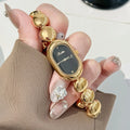 Women's oval fashion watch in black gold colour with 9mm thickness case