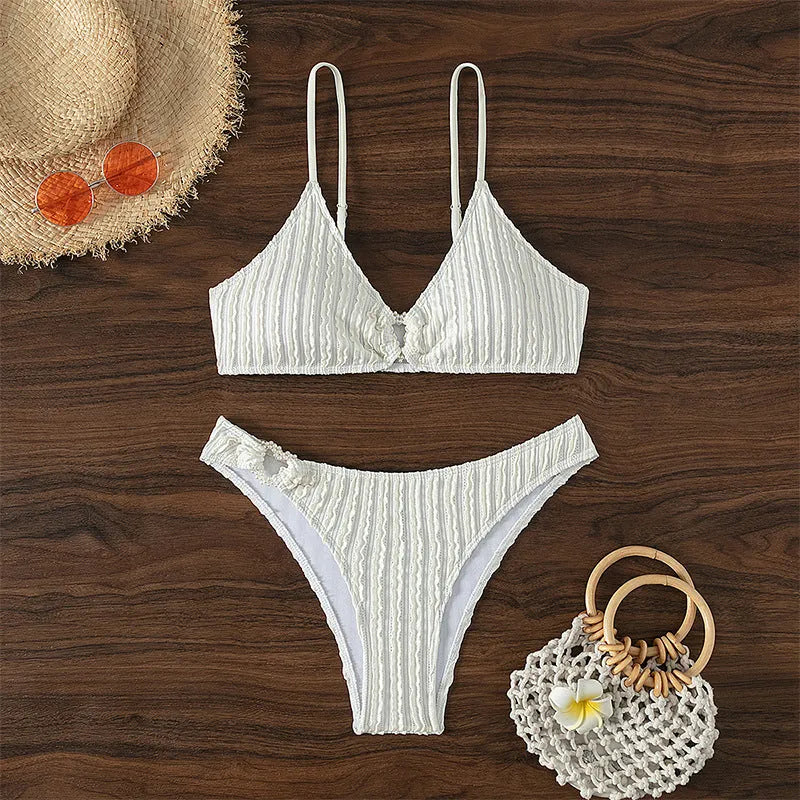 Women's white V-neck split swimsuit with sleeveless design, top and shorts set for beach swimming