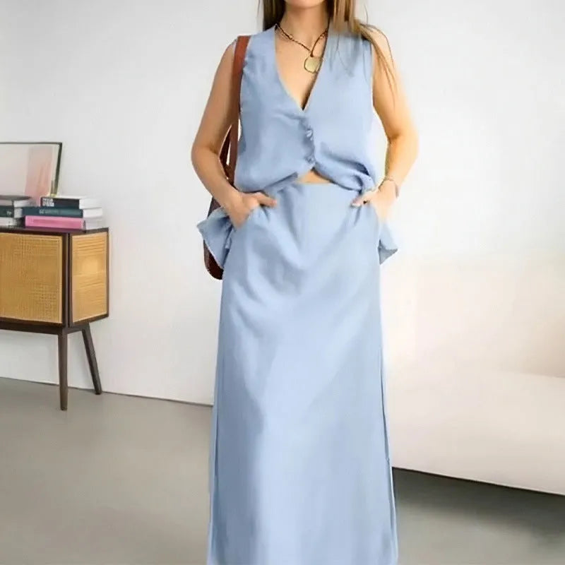 Casual loose top long skirt two-piece suit in blue, featuring a sleeveless vest and long skirt made from polyester fabric.
