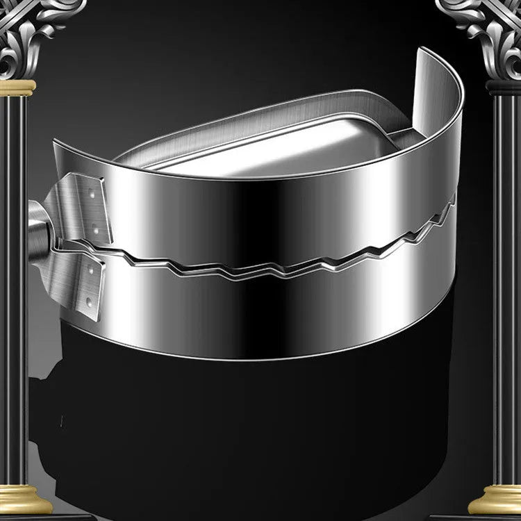 Silver stainless steel manual dumpling press mould with handle on a kitchen worktop.