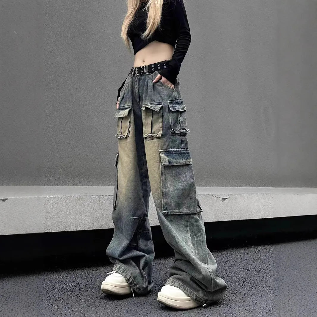 Man wearing light blue loose fit distressed jeans with multiple pockets and straight leg style.